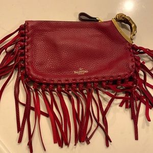 Vintage Valentino clutch.With documents and dusty bag. In excellent condition.